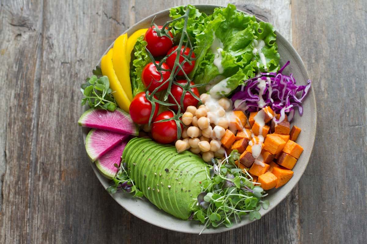 Fresh healthy food neatly organized in refrigerator with clear containers and fresh produce